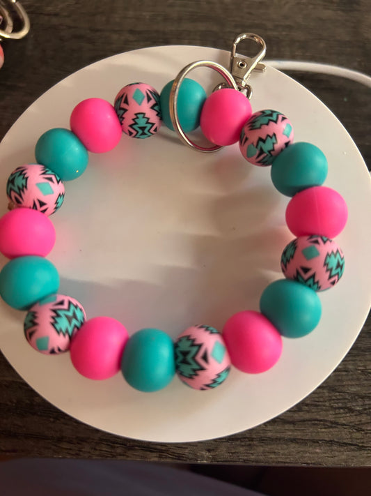 Pink & Teal Wristlet With A Design