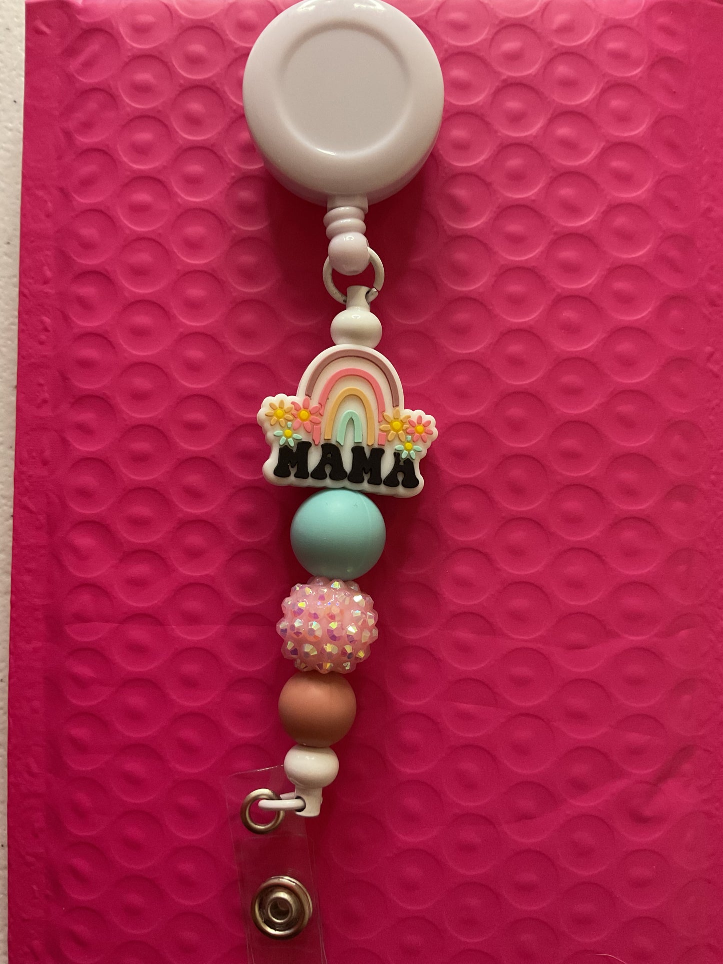 Neutral Mama rainbow badge reel